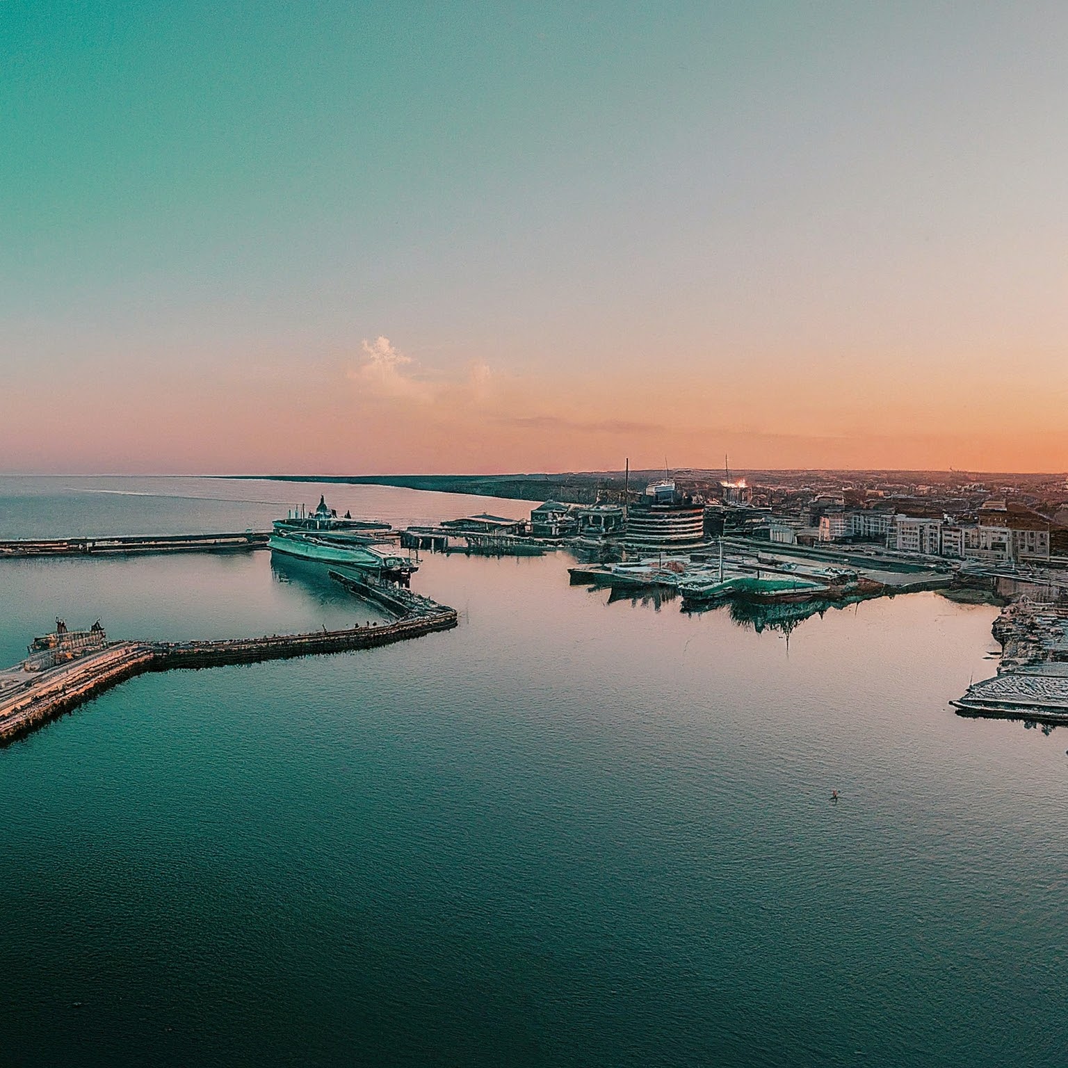 Panoramic view of Constanta Harbor, Romania, with ships and the city skyline.