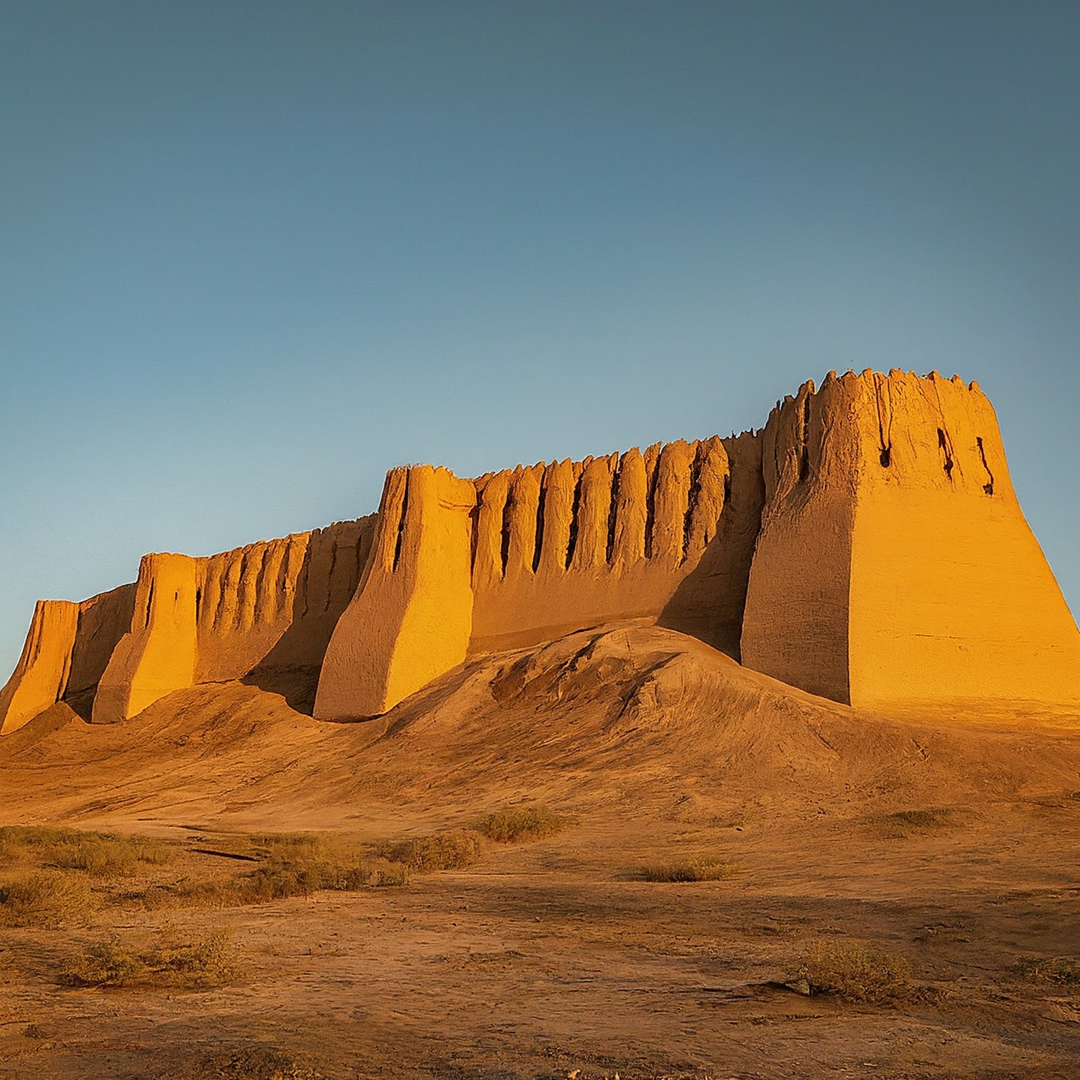 Great Kyz Kala Fortress in Merv, Turkmenistan, with mudbrick walls and towers.