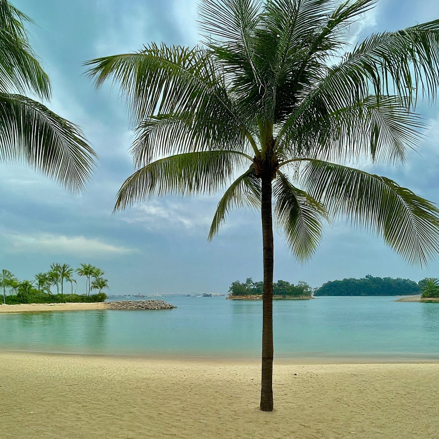 Tranquil scene of Tanjong Beach on Sentosa Island, Singapore.