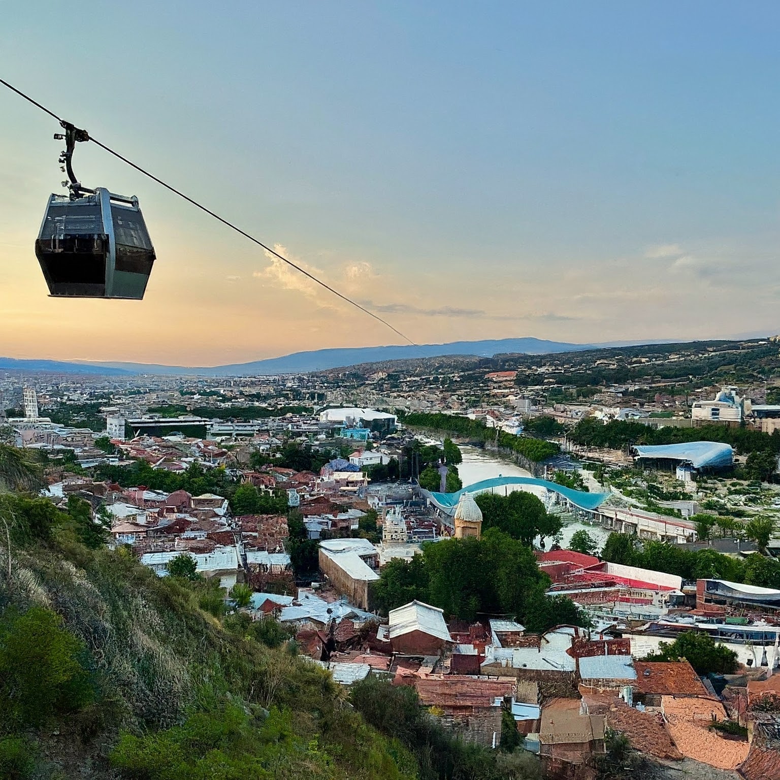 Tbilisi, Georgia: Cable car ride up a mountainside with panoramic city views and the Kura River.