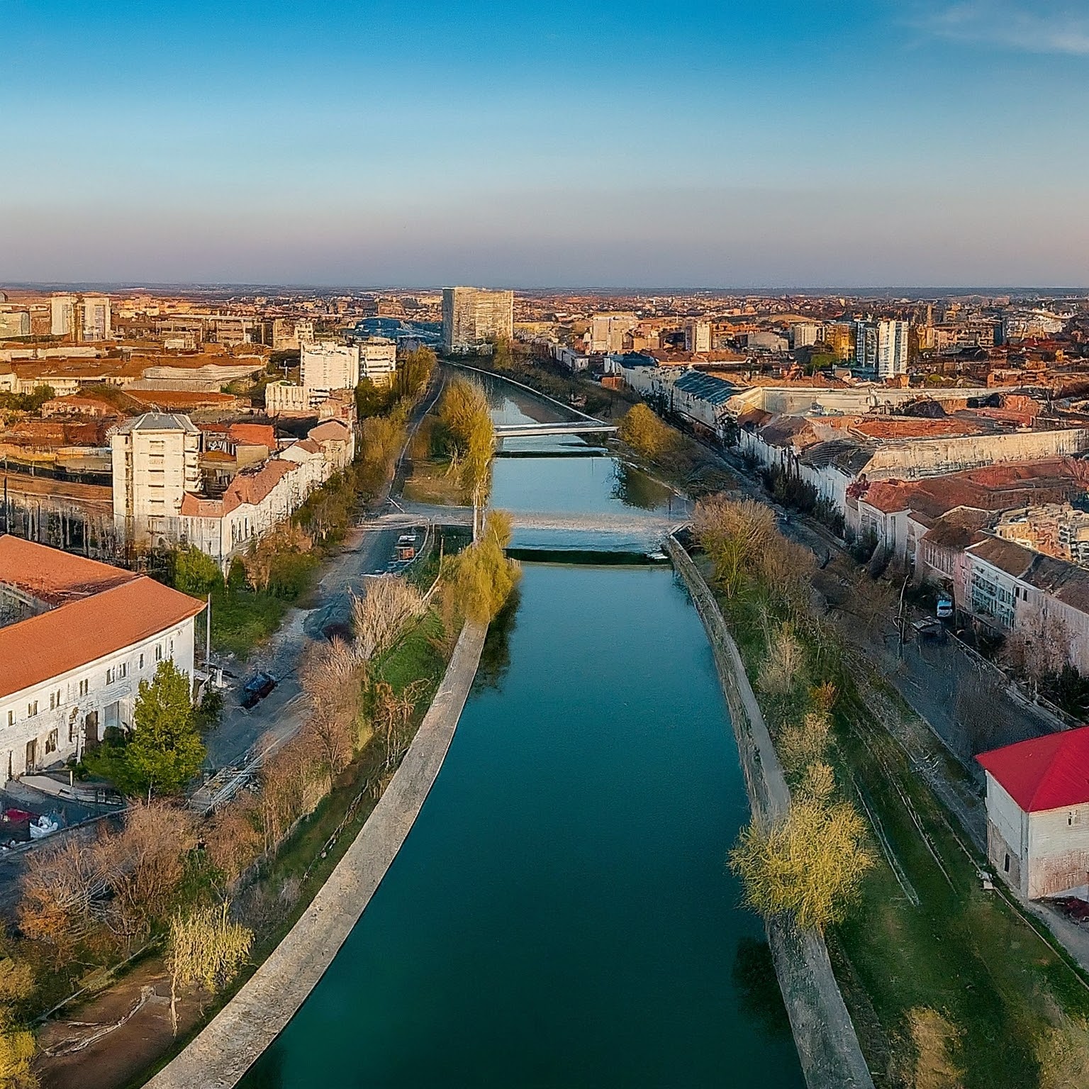 Panoramic view of Timisoara, Romania, with the Bega River winding through the city.