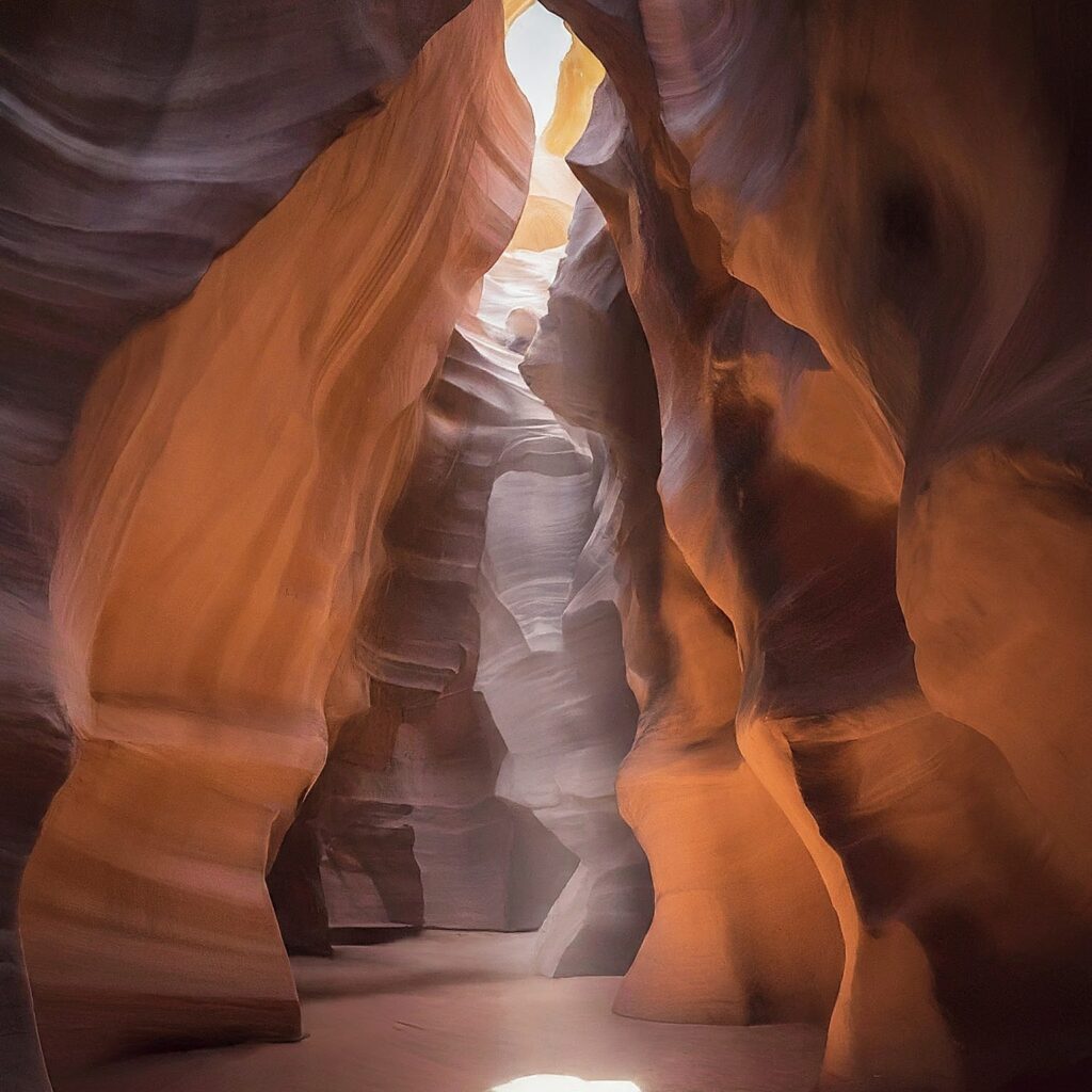 Sunlight illuminates the sculpted sandstone walls of Antelope Canyon in the USA.