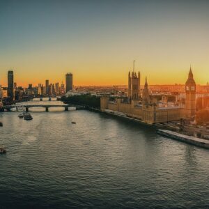 Panoramic view of London at sunset showcasing iconic landmarks.