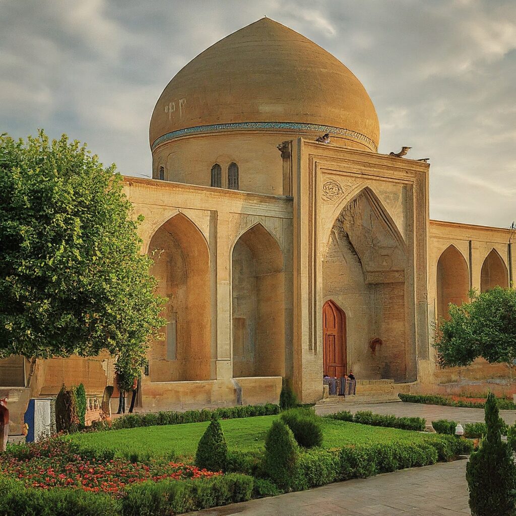 Shah Abbas Mosque in Ganja, Azerbaijan, at sunrise with people in the gardens.