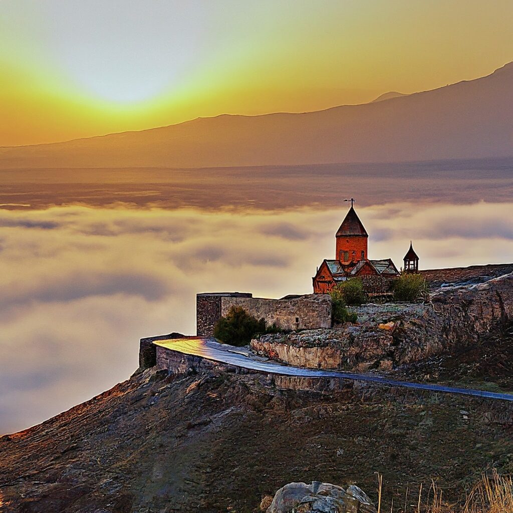 Khor Virap Monastery in Armenia at sunrise with mist rising from the ground.